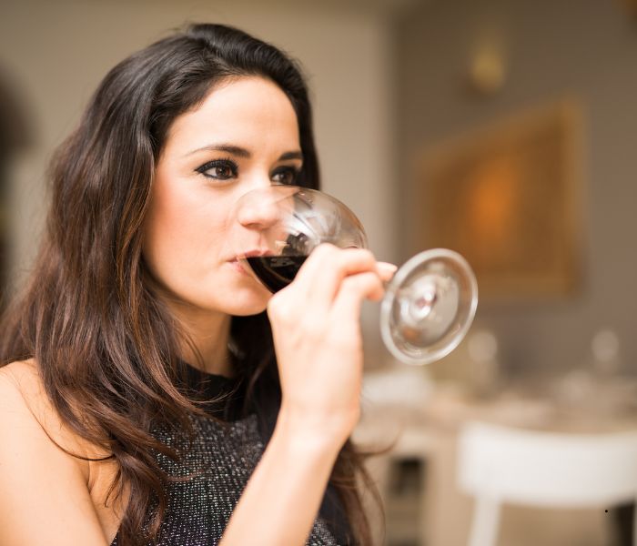 lady drinking glass of wine